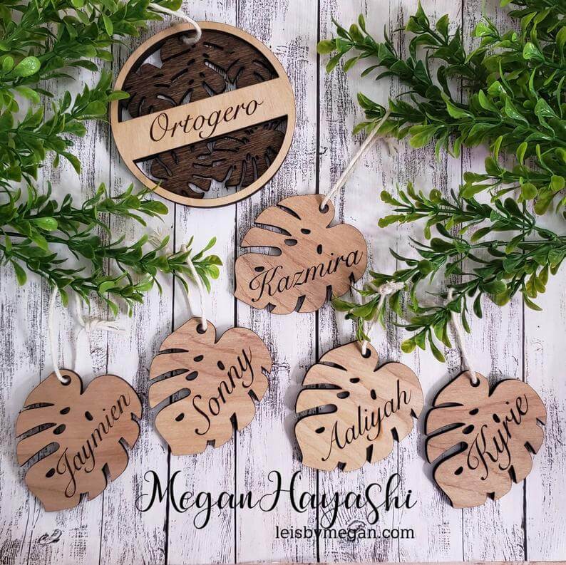 20 Hawaiian Christmas Ornaments featured by top Hawaii blogger, Hawaii Travel with Kids: Personalized Wooden Monstera Ornament Set personalized 5 monstera leaves