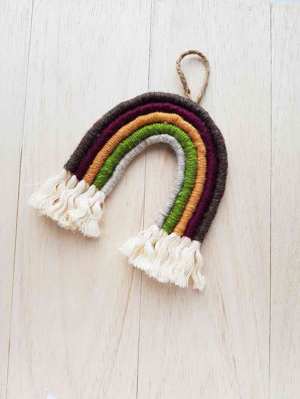 How to Make a Macrame Rainbow Wall Hanging, a DIY Hawaiian decoration featured by top Hawaii blogger, Hawaii Travel with Kids.