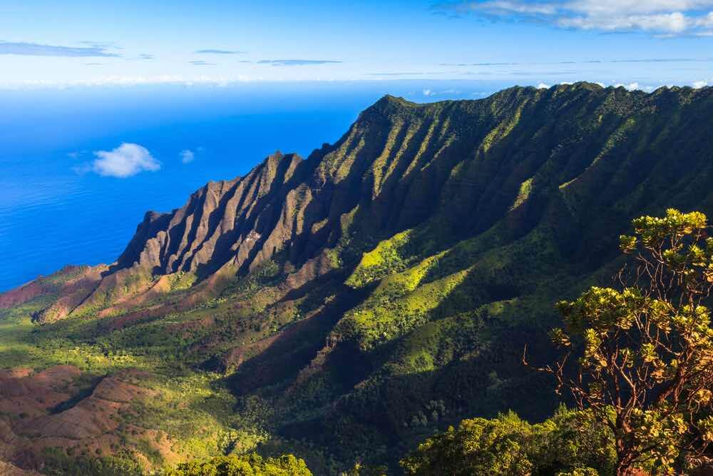 Head to Kalalau Valley to watch sunset in Kauai. Image of Morning scene at the Napali Coast in Kauai, Hawaii Islands.