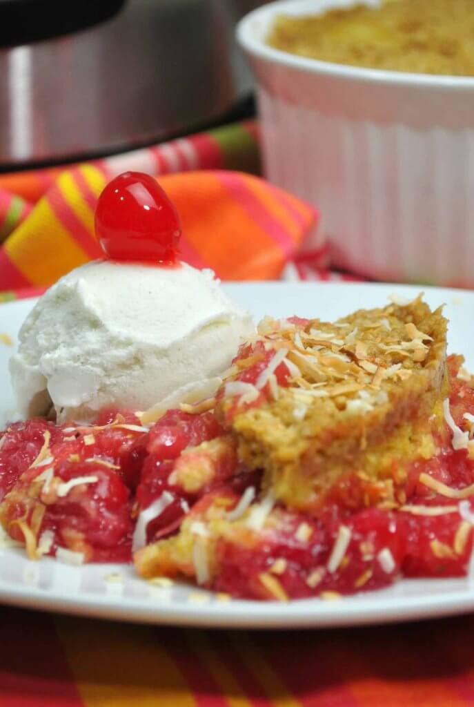 Your family will love this easy pineapple coconut cake topped with ice cream and cherries