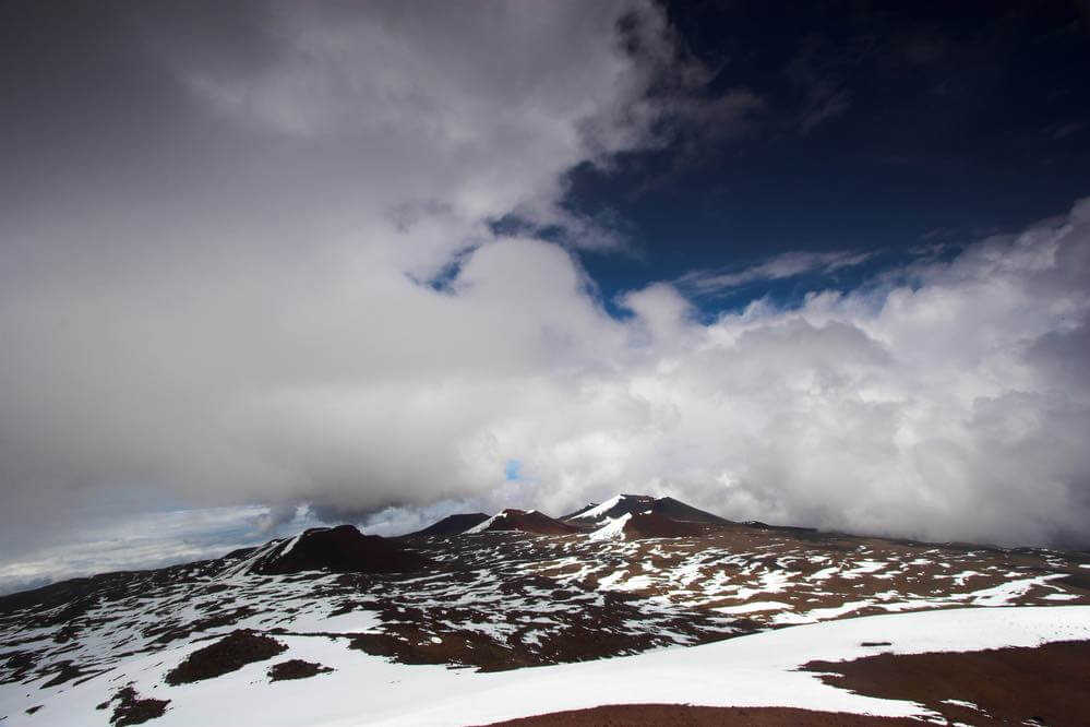 Yes, that's snow at Mauna Kea on the Big Island. Image of Volcanic landscape and snow on the summit of Mauna Kea in Hawaii