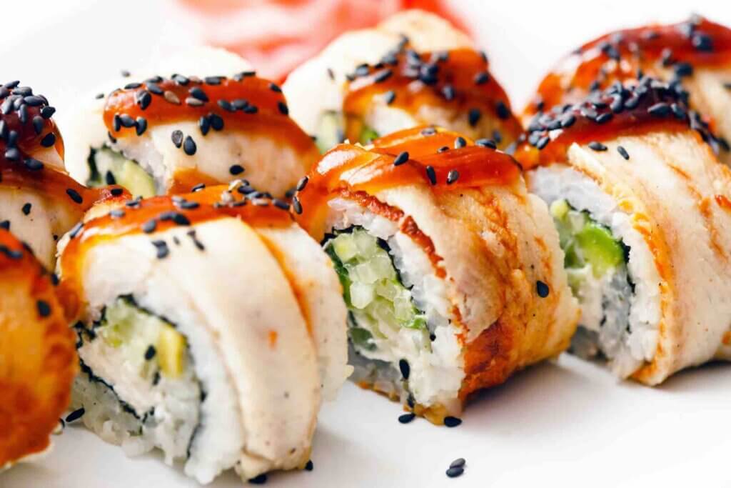 There are tons of places to get sushi in Maui. Image of sushi rolls on a white plate.