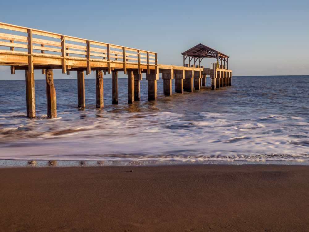 Head to Waimea Pier for a sunset Kauai photo shoot. Image of Waimea Pier at sunset.