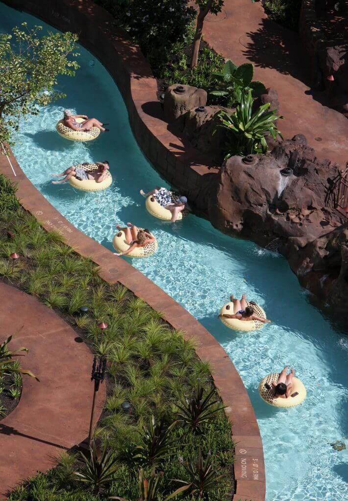 Aulani tips and Disney Aulani Resort review featured by top Hawaii blog, Hawaii Travel with Kids: Photo of Waikolohe Stream at Disney Aulani Resort on Oahu in Hawaii. One of my Aulani tips is to plan for several hours on this lazy river.