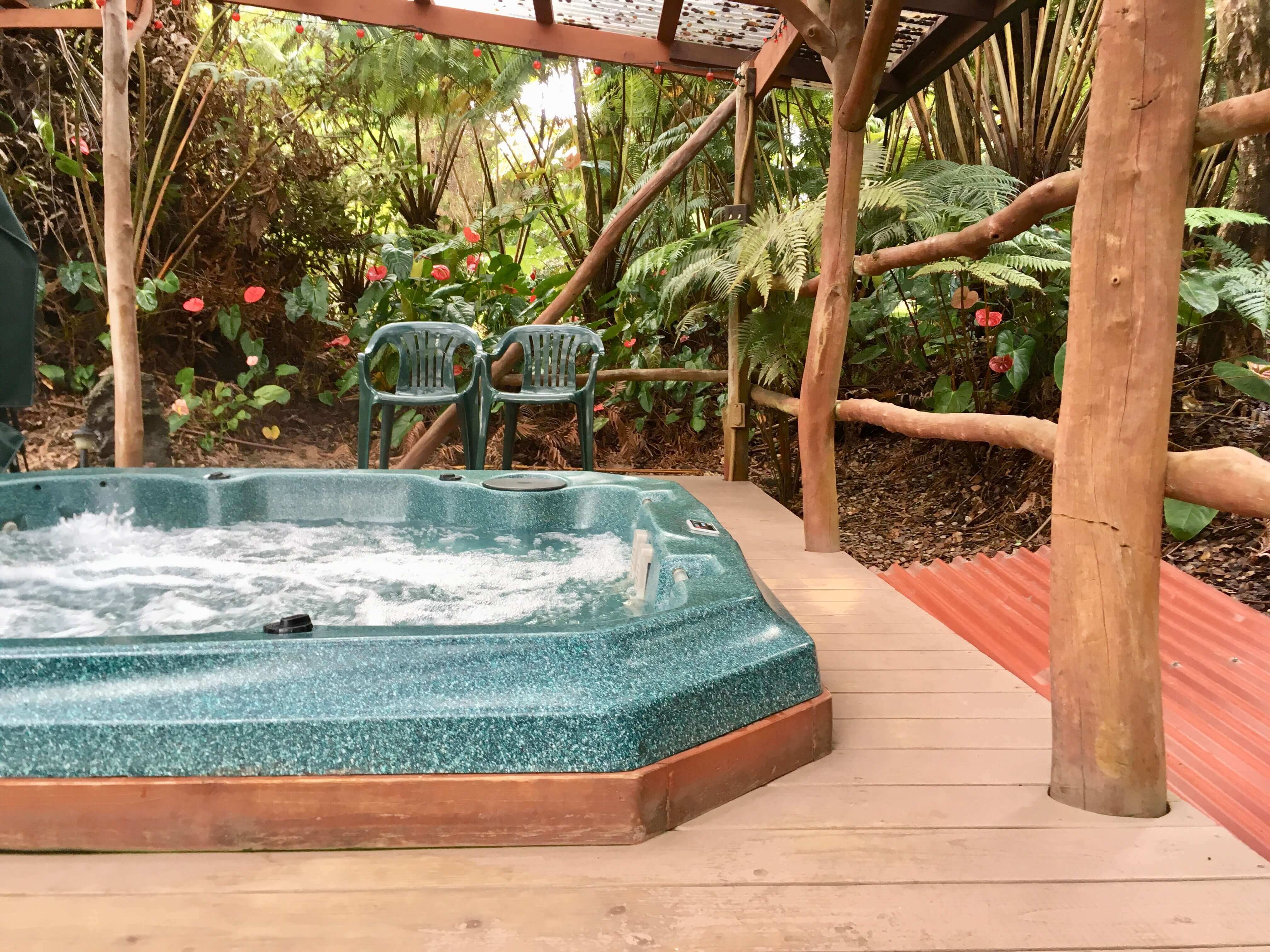 Hawaii on a Budget: Top 10 Cheap Big Island Hotels featured by top Hawaii travel blog, Hawaii Travel with Kids: Kilauea hotel-volcano inn - hot tub in rainforest