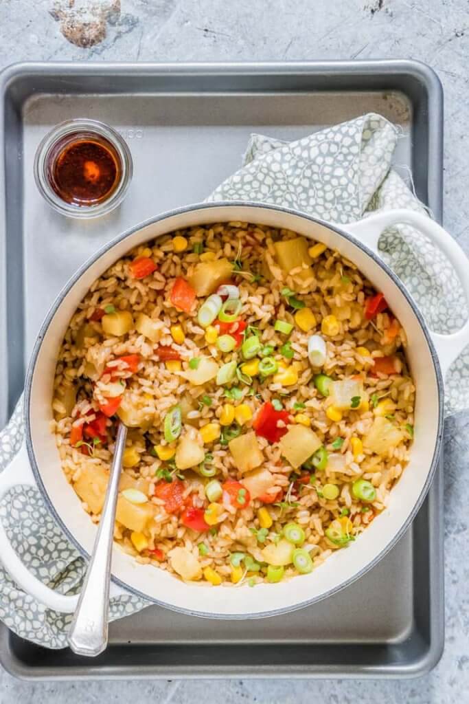 Learn how to make easy Pineapple Fried Rice. Image of a bowl of pineapple fried rice.