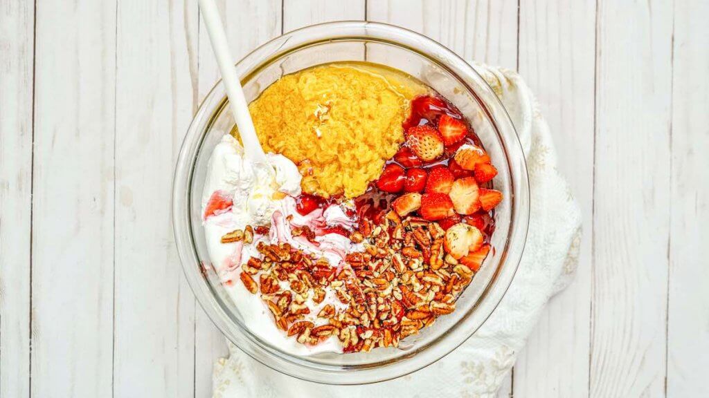 Place all your pineapple salad dessert ingredients in a bowl.