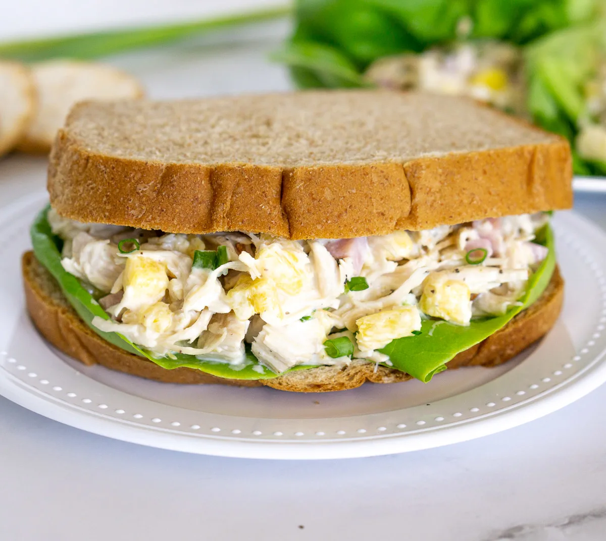 chicken salad with pineapples in a sandwich