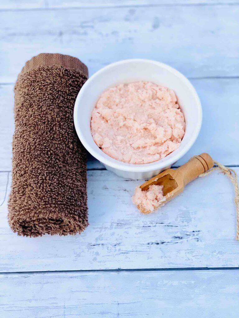 This coconut scrub makes a great gift or save it for yourself! Image of a bowl of homemade body scrub with coconut oil 