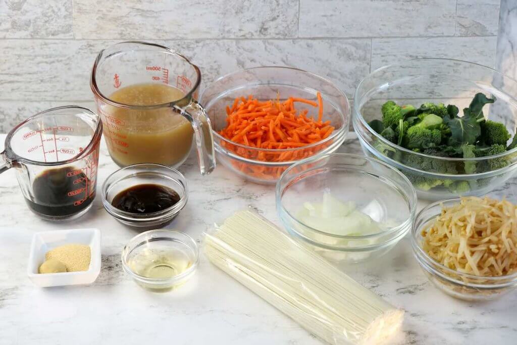 Vegetable Lo Mein ingredients. Image of bowls full of vegetables and sauces.