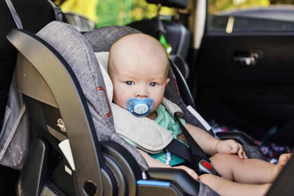 Do you need a car seat in Hawaii? Image of baby boy in the car seat in summer