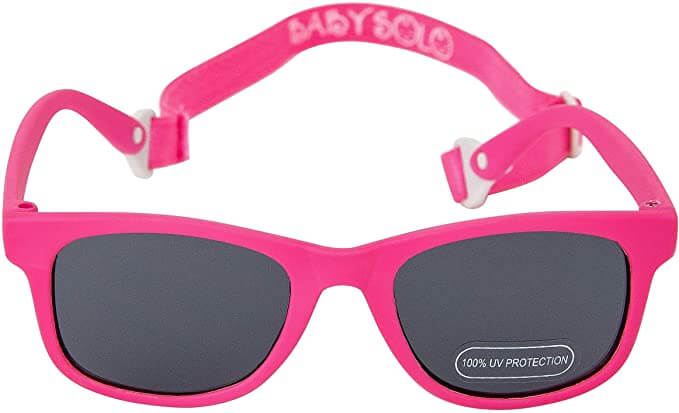 It's helpful to get baby sunglasses with a strap to ensure it stays on your baby's head. Image of a pair of pink baby sunglasses.