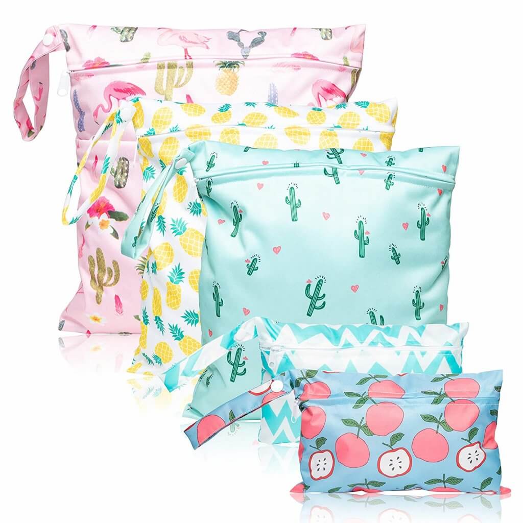 Image of 5 wet bags with fun prints like pineapples, apples, cacti, flamingos, and chevron.