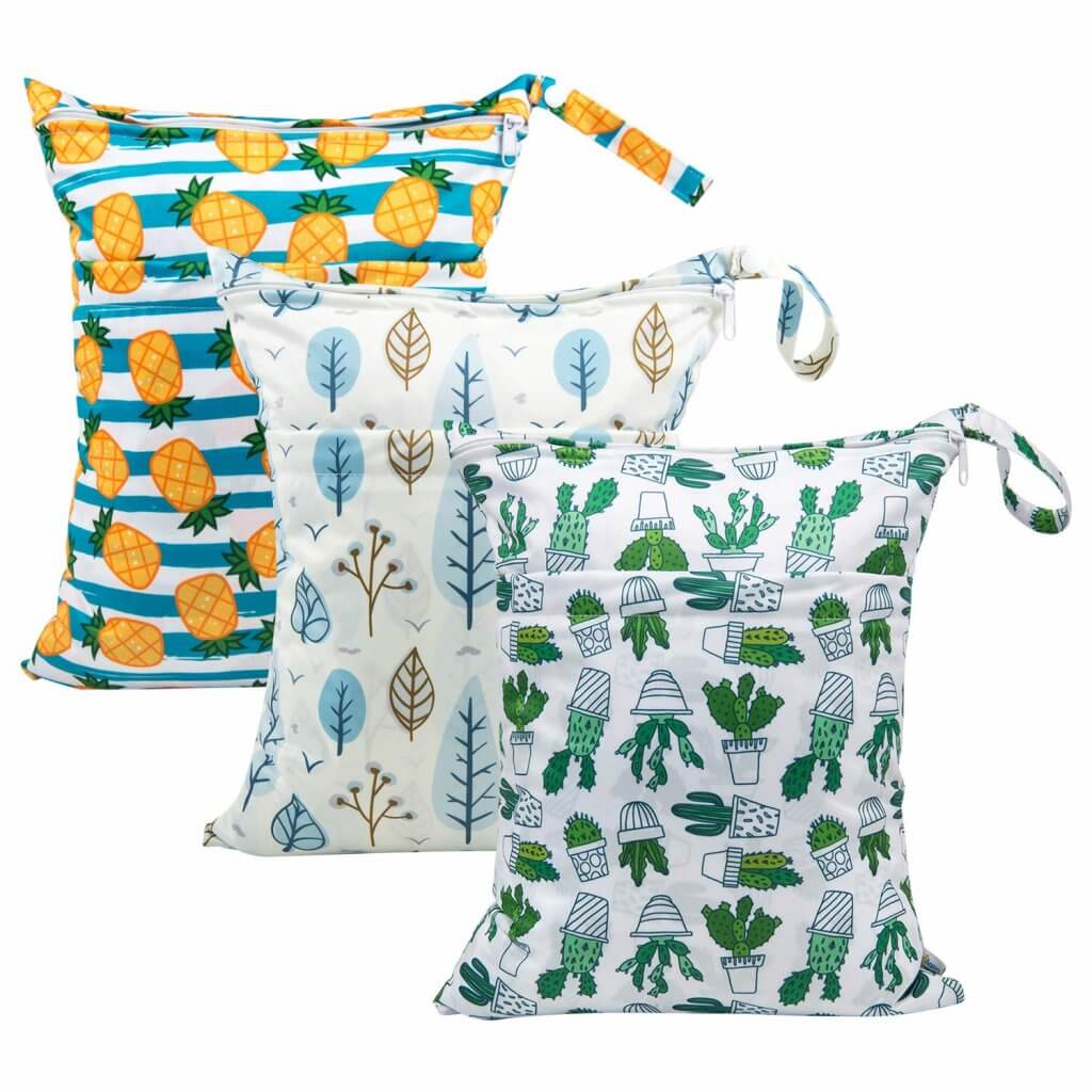 This set of wet dry bags are baby beach must haves. Image of 3 wet dry bags including pineapple print, leaves, and cacti.