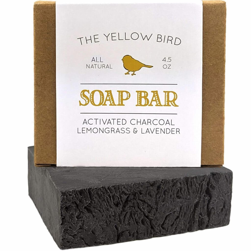 Add a charcoal soap bar to your zero waste travel kit for Hawaii. Image of a charcoal soap bar from The Yellow Bird.