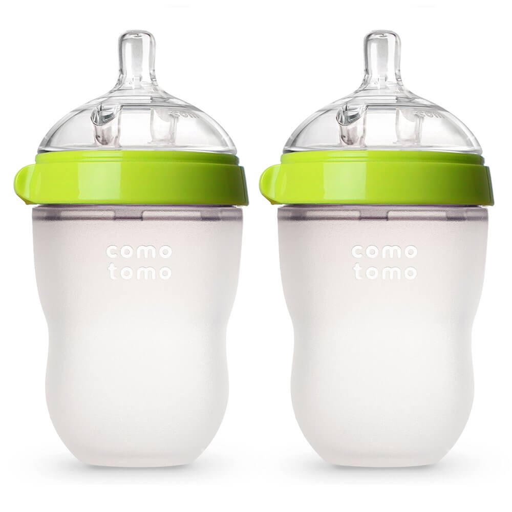 Don't forget to pack baby bottles for the beach to keep your baby hydrated. Image of two baby bottles.