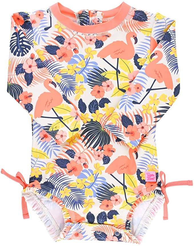 SPF rash guards are beach necessities for babies in Hawaii. Image of a tropical print baby swimsuit with flamingos on it.