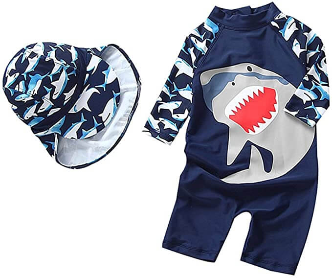 And SPF swimsuit and sun hat are the best best baby gear for beach. Image of a shark print one piece baby swimsuit and hat.