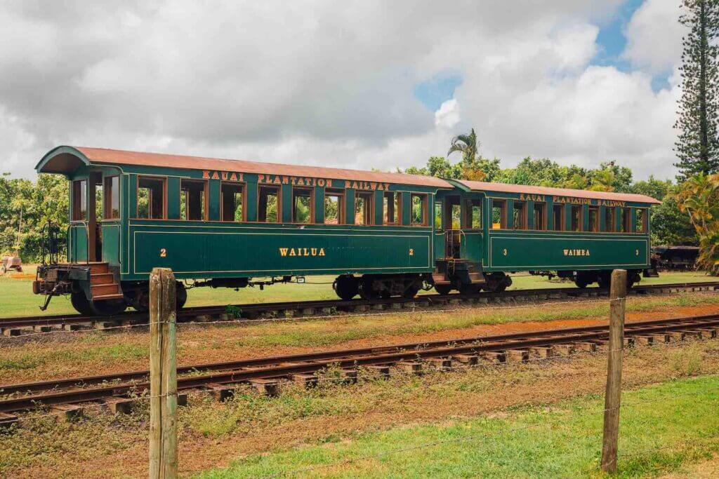 Kilohana Plantation was one of hte Kauai filming locations for the new Disney movie Jungle Cruise. Image of a green train at Kilohana Plantation on Kauai.