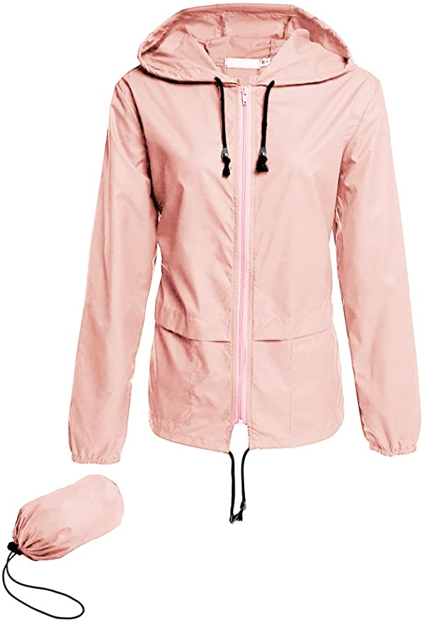 Add this packable rain jacket to your Hawaii packing list. Image of a light pink rain jacket that fits into a little pouch.