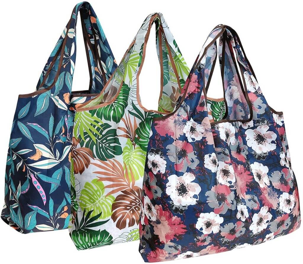 You'll need to bring your own bags to Hawaii. Image of 3 tropical reusable bags.