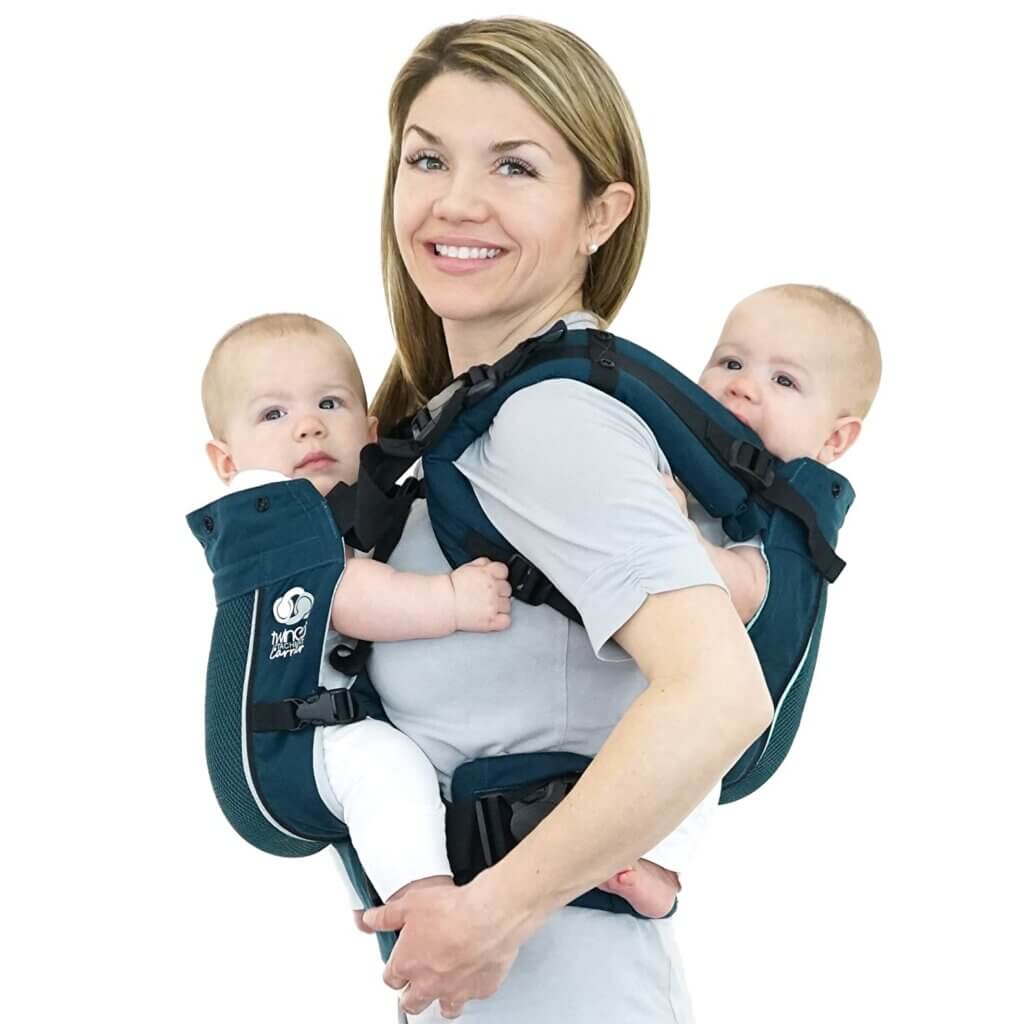 The TwinGo Air is one of the best baby carriers for hot weather. Image of a blond mom with two babies in a teal carrier.
