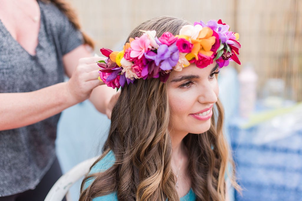 Image of a woman wearing a Hawaiian flower crown.