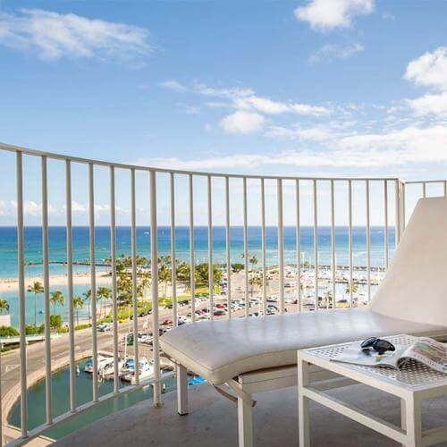 The Modern Honolulu is one of the top luxury hotels on Oahu for celebrities. Image of an oceanfront balcony.