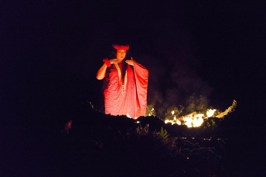 Image of Pele, the Hawaiian goddess of fire and volcanoes as she dances at a Kauai luau.