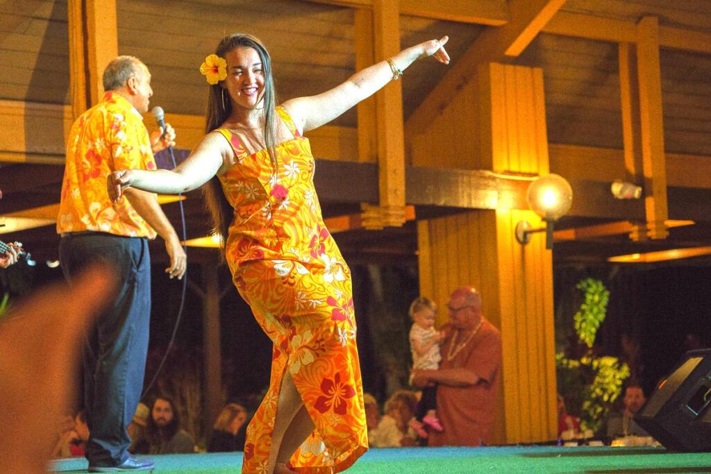 Image of a woman dancing hula at Smith's Family Luau on Kauai.