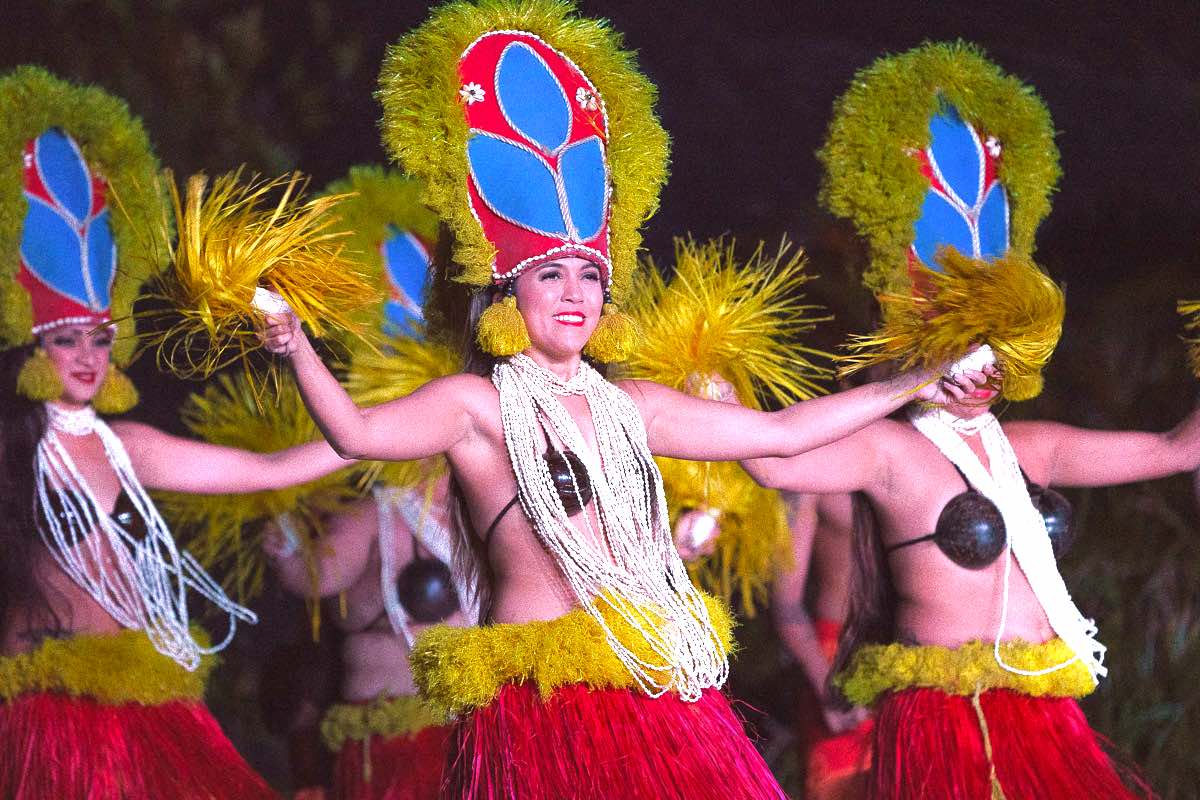 Get a detailed review of Smith's Tropical Paradise, one of the best Kauai luaus, by top Hawaii blog Hawaii Travel with Kids. Image of a group of Tahitian dancers at Smith Family Luau on Kauai.