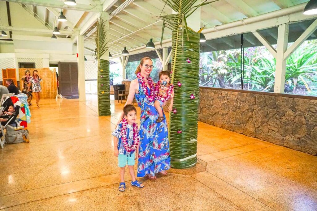 Image of a mom and two boys at Toa Luau at Waimea Valley on Oahu.