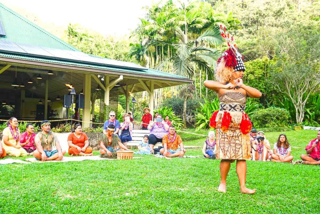 This Oahu luau features a lot of Samoan culture in addition to Hawaiian traditional dancing. Image of a Samoan princess dancing in front of a crowd.