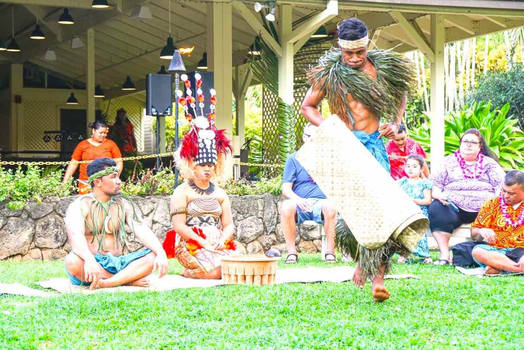 Toa Luau is on of the top Oahu kids activities for toddlers and preschoolers. Image of a Samoan performer helping with a Kava Ceremony.