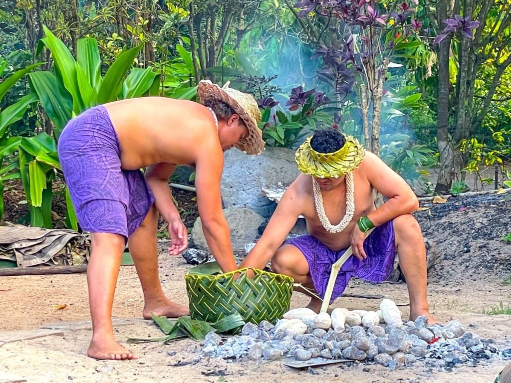Looking for the best luaus in Oahu Hawaii? Check out this Toa Luau review by top Hawaii blog Hawaii Travel with Kids. Image of a Samoan fire knife dance outside at a Hawaii luau.