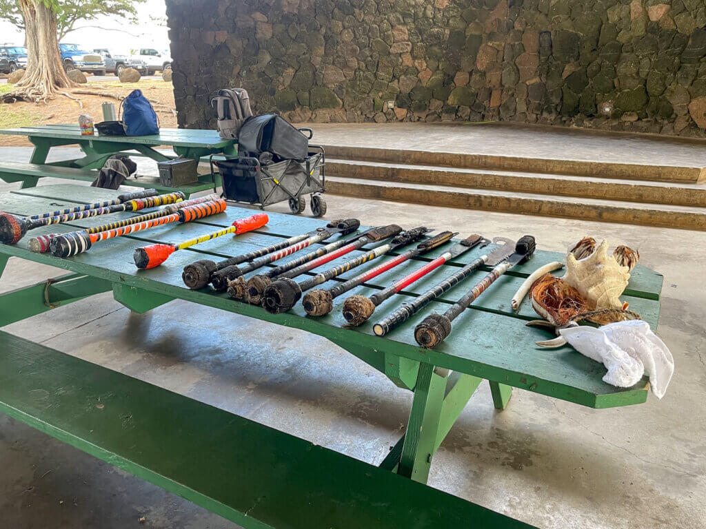 This Hawaii fire dancers workshop featured practice knives for us to choose before class. Image of a bunch of sticks with foam ends on it.