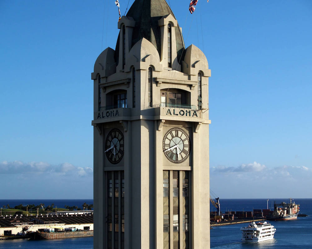 The Aloha Tower is one of the most haunted places in Hawaii because there are ghosts of WWII sailors who live here. Image of a tall tower in Hawaii.