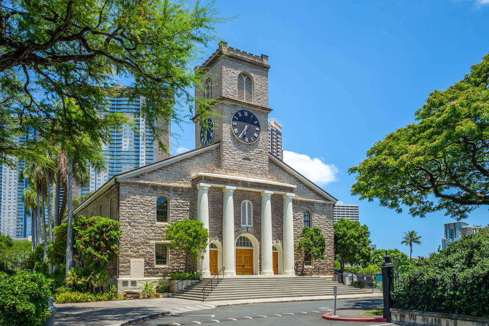 Kawaiahao Church is one of the most haunted places in Hawaii because the graveyard is frequently visited by Night Marchers. Image of the exterior of the Kawaiaha'o Church in Honolulu.