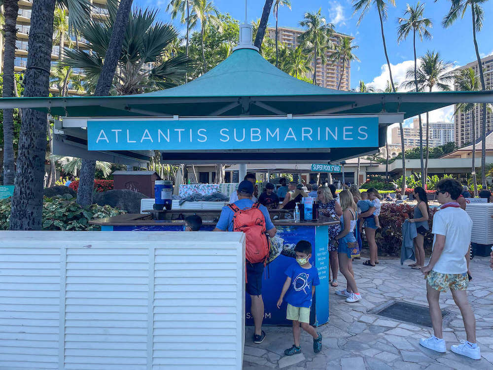 Get your Waikiki Atlantis Submarine tickets online or at the kiosk at the Hilton Hawaiian Village. Image of the Atlantis Submarine kiosk at the Hilton Hawaiian Village in Waikiki.