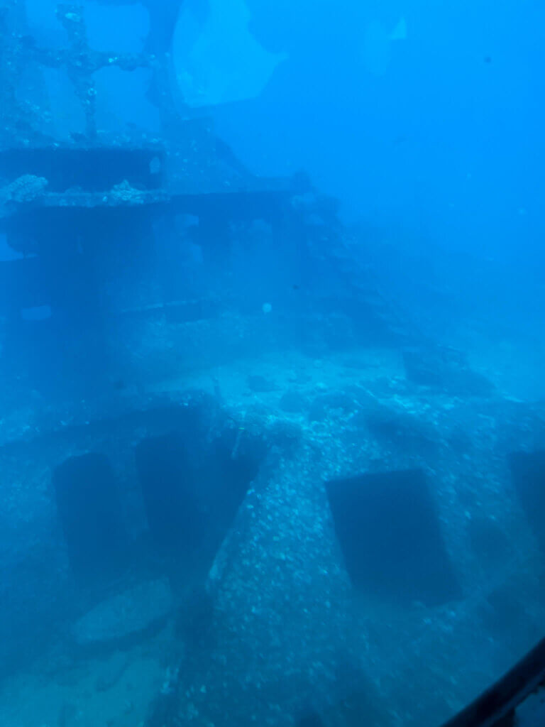 Image of an underwater ship wreck off the coast of Waikiki.