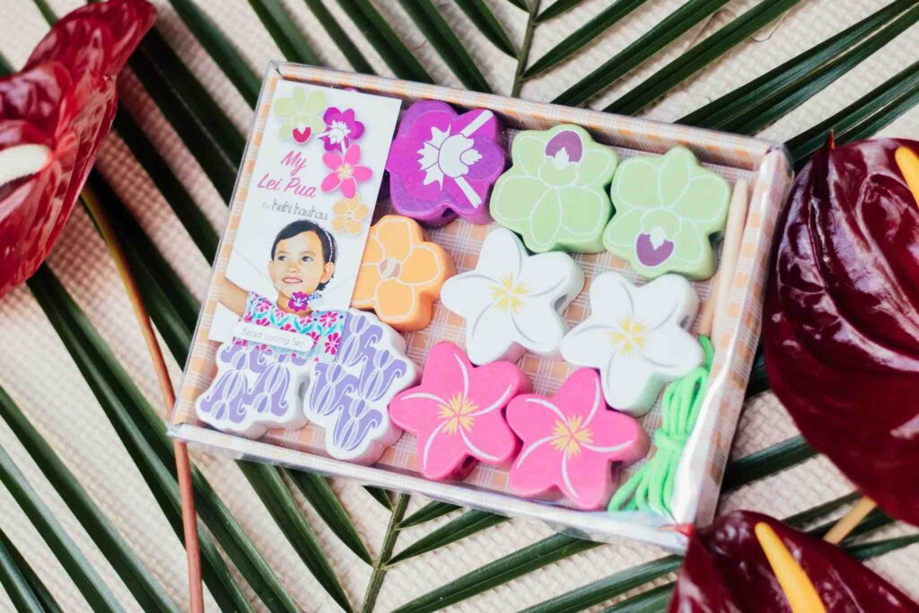 Looking for a bead threading set for toddlers? Check out this Hawaiian wooden toy where kids can string a lei.