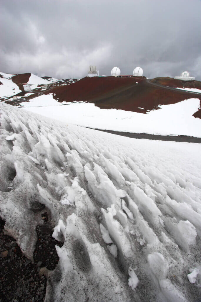 Find out how to go skiing at Mauna Kea on the Big Island of Hawaii. Image of snow at Mauna Kea summit.