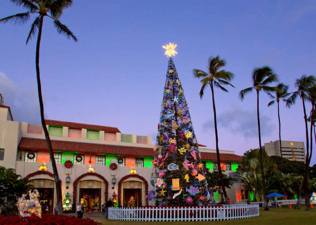 Find out where to see Christmas lights in Hawaii by top Hawaii blog Hawaii Travel with Kids. Image of an outdoor Christmas tree in Honolulu.