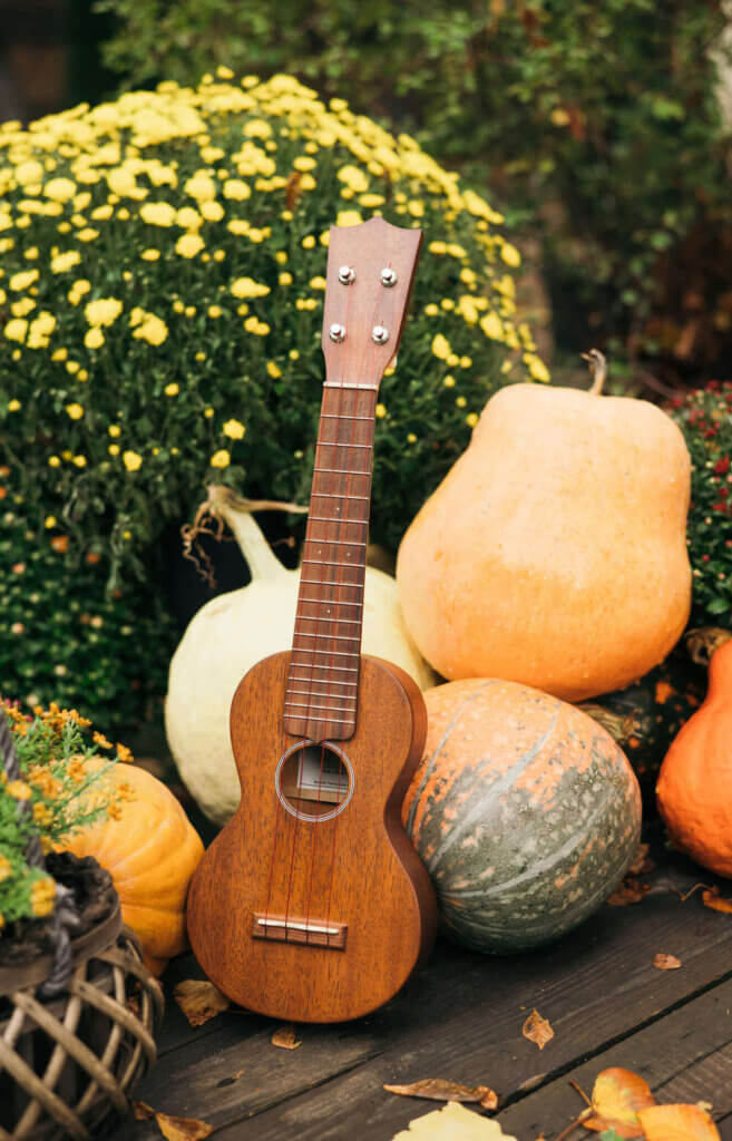 Find out the best things to do in Hawaii in October by top Hawaii blog Hawaii Travel with Kids. Image of an ukulele and pumpkins