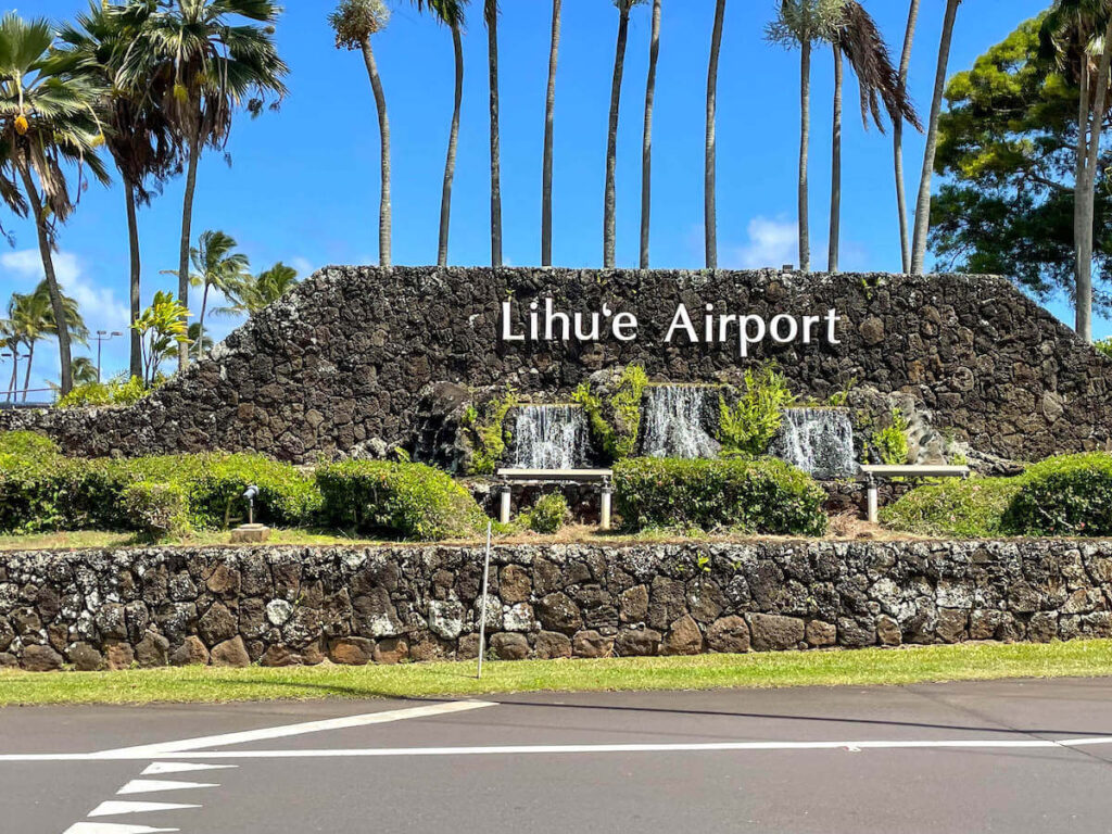 Find out everything you need to know about Lihue Airport on Kauai by top Hawaii blog Hawaii Travel with Kids. Image of the Lihue Airport sign