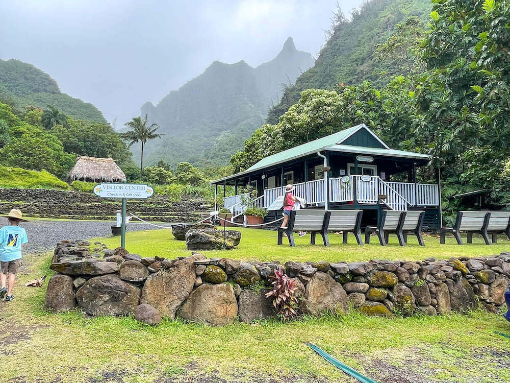 Should you explore the Limahuli Garden in Hanalei Kauai? Read this review by top Hawaii blog Hawaii Travel with Kids. Image of the Limahuil visitor center on Kauai.