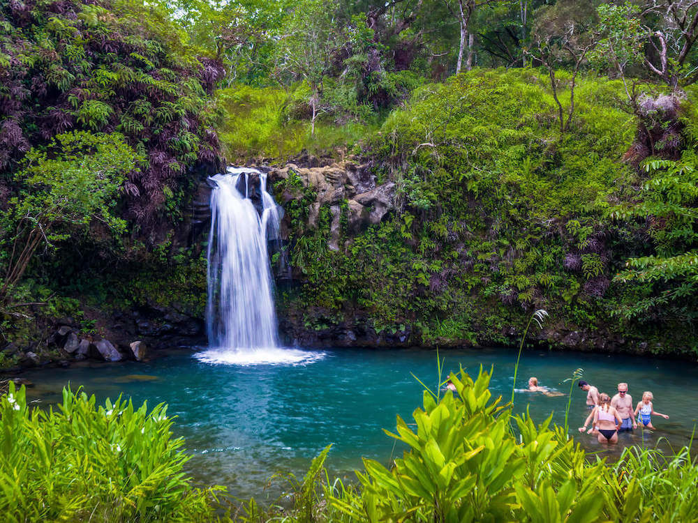 One of the best Maui waterfalls is Pua'a Ka'a Falls on the Road to Hana. Image of a beautiful waterfall on Maui.