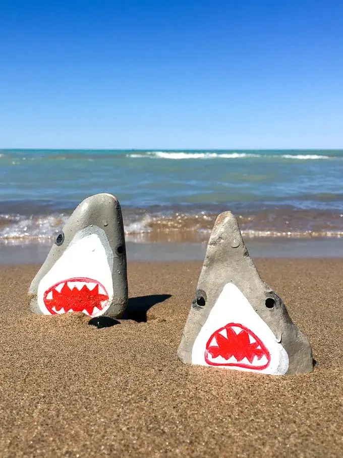 These shark painted rocks are fun ocean crafts for kids