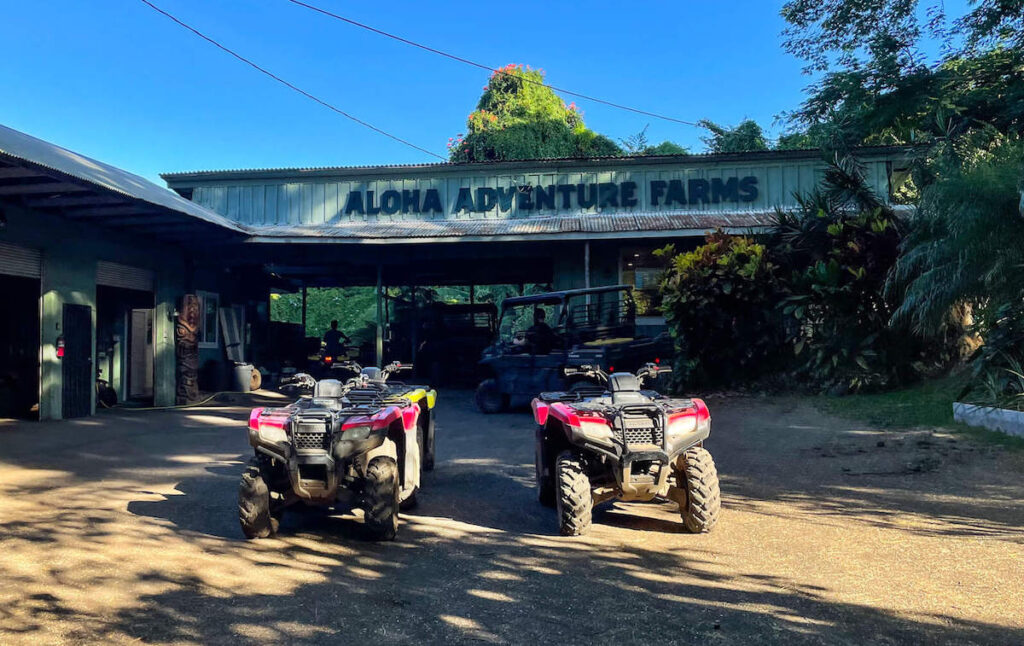 Find out the best Big Island ATV tour recommended by top Hawaii blog Hawaii Travel with Kids. Image of ATVs in front of Aloha Adventure Farm on the Big Island of Hawaii.