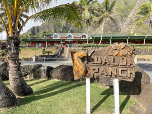 Findo ut the best things to do at Kualoa Ranch on Oahu by top Hawaii blog Hawaii Travel with Kids. Image of the Kualoa Ranch sign